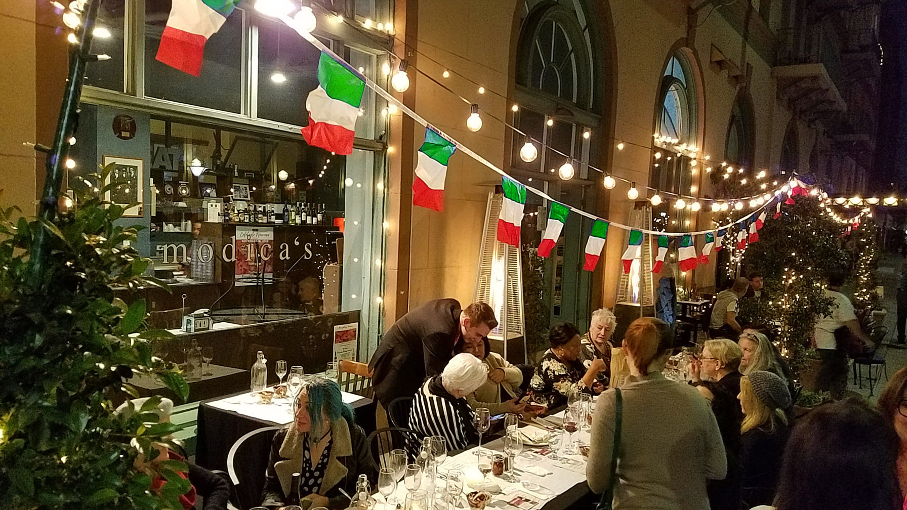 Modica's outdoor patio with Italian flags